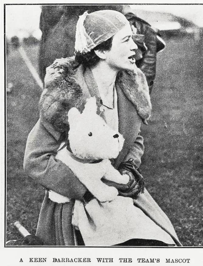 A keen barracker with the team's mascot