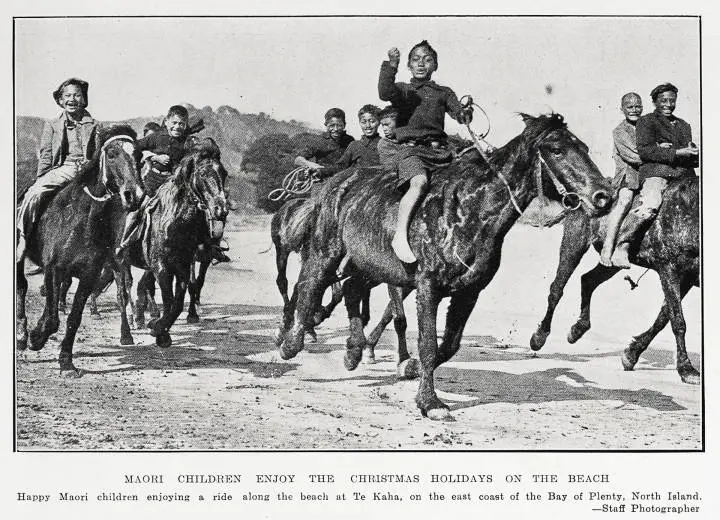 Māori children enjoy the Christmas holidays on the beach