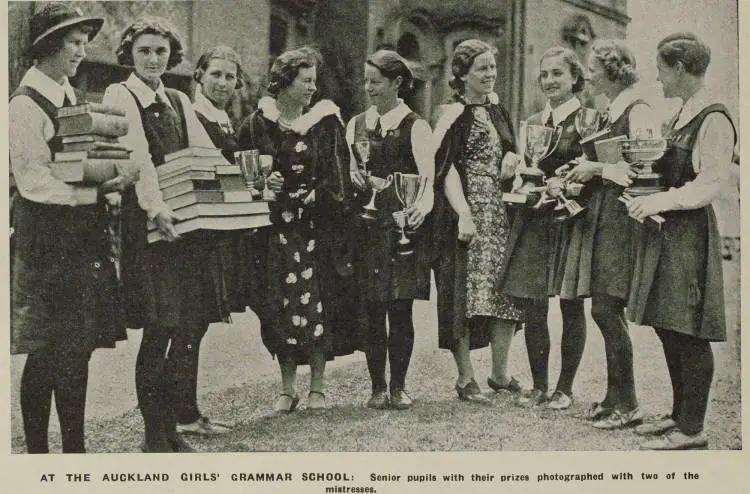 Senior pupils from Auckland Girls' Grammar School with books and trophies awarded during prize-giving