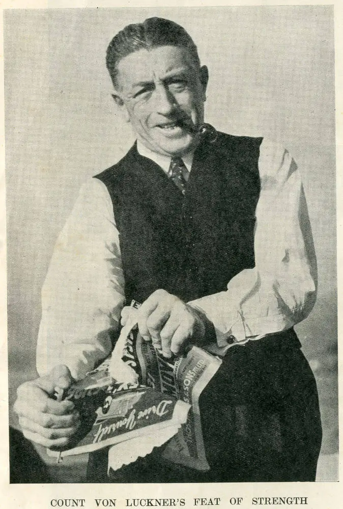 Count von Luckner tears a city telephone directory into four pieces