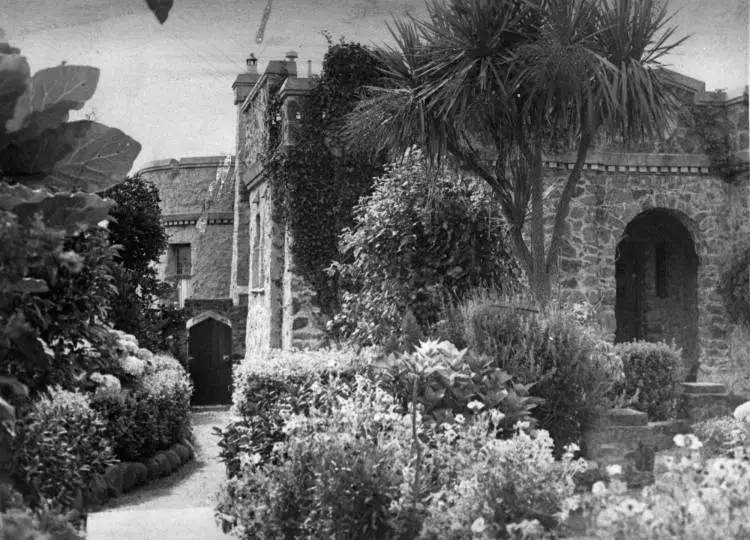 Algie's castle showing gardens and side gate, 253 Hurstmere Road, Takapuna.