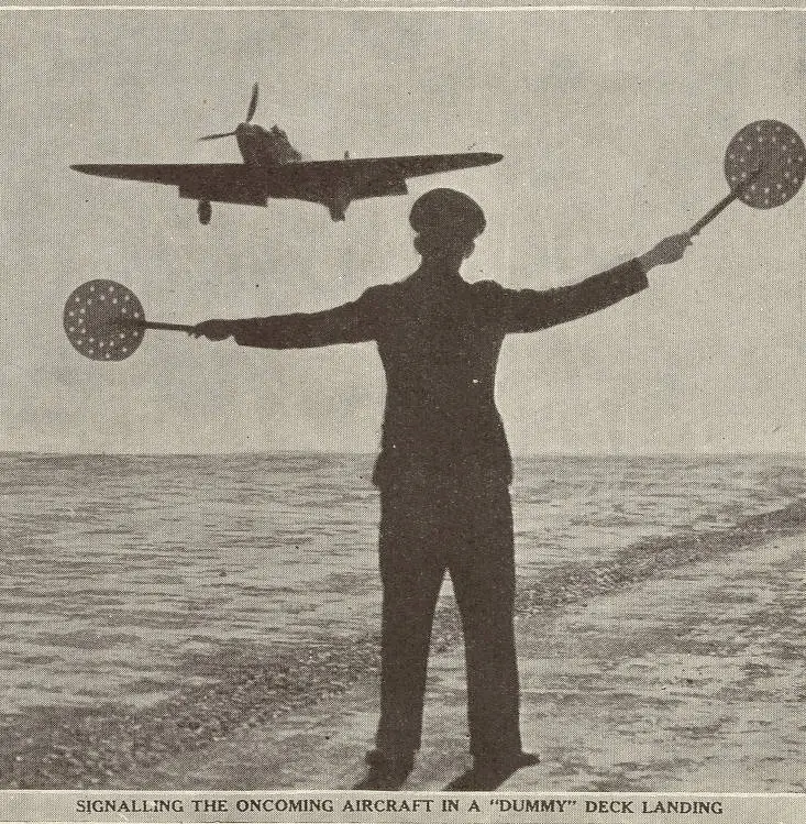 Signalling the oncoming aircraft in a 'dummy' deck landing