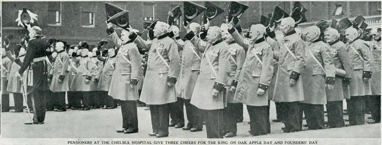 Pensioners at the Chelsea Hospital give three cheers for the King on Oak Apple Day and Founders' Day