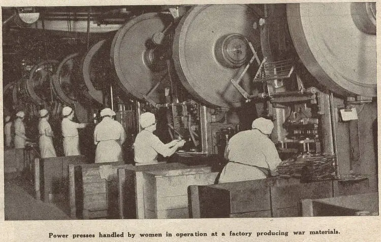 Power presses handled by women in operations at a factory producing war materials