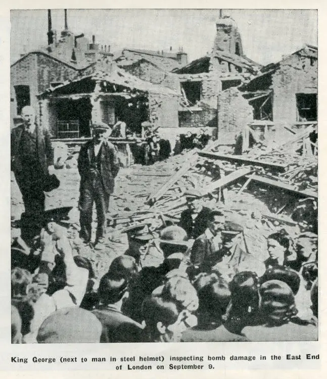 King George (next to man in steel helmet) inspecting bomb damage in the East End of London on September 9