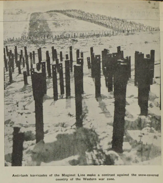 Anti-tank barricades of the Maginot Line make a contrast against the snow-covered country of the western war zone