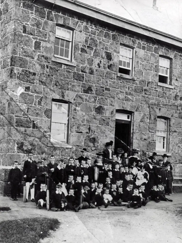 Front view of St Joseph's orphanage with boys, Taharoto Road, Takapuna.
