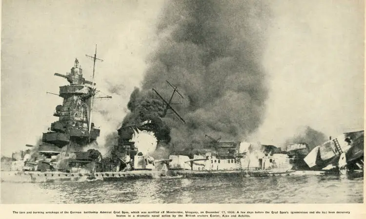 The torn and burning wreckage of the German battleship Admiral Graf Spee