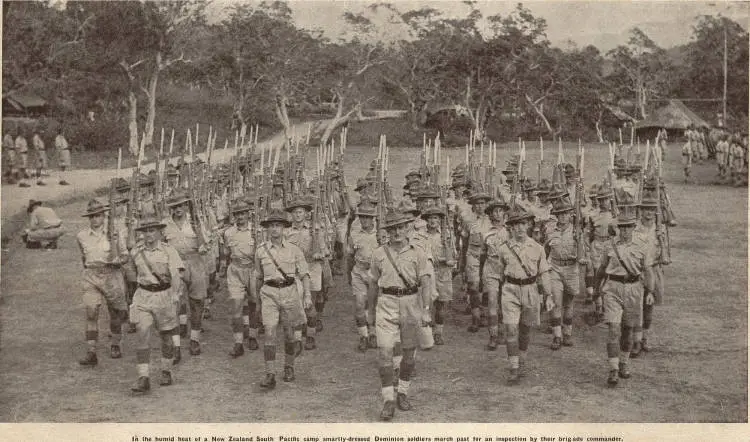 Smartly-dressed Dominion soldiers march past for an inspection in a New Zealand South Pacific camp