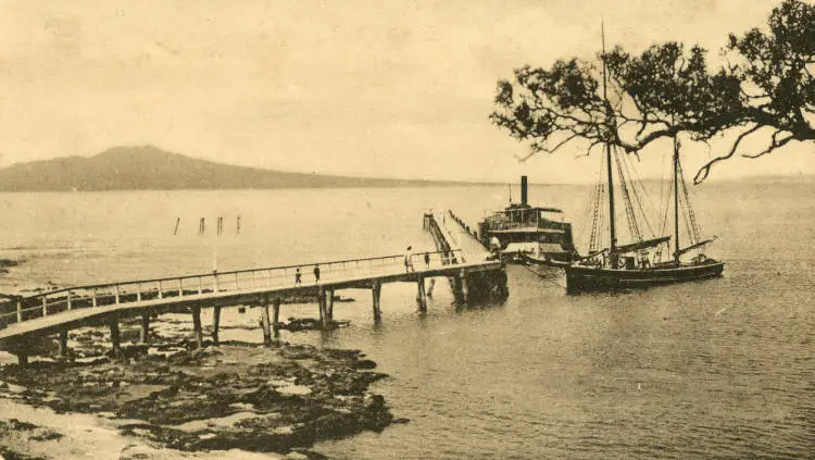 Postcard of sailing boat and ferry SS Britannia at Takapuna wharf.