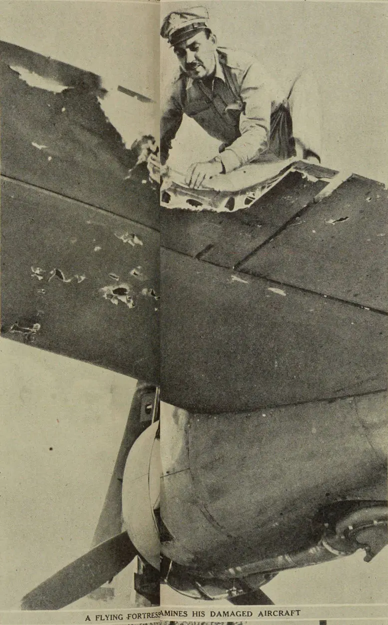 A Flying Fortress pilot examines his damaged aircraft