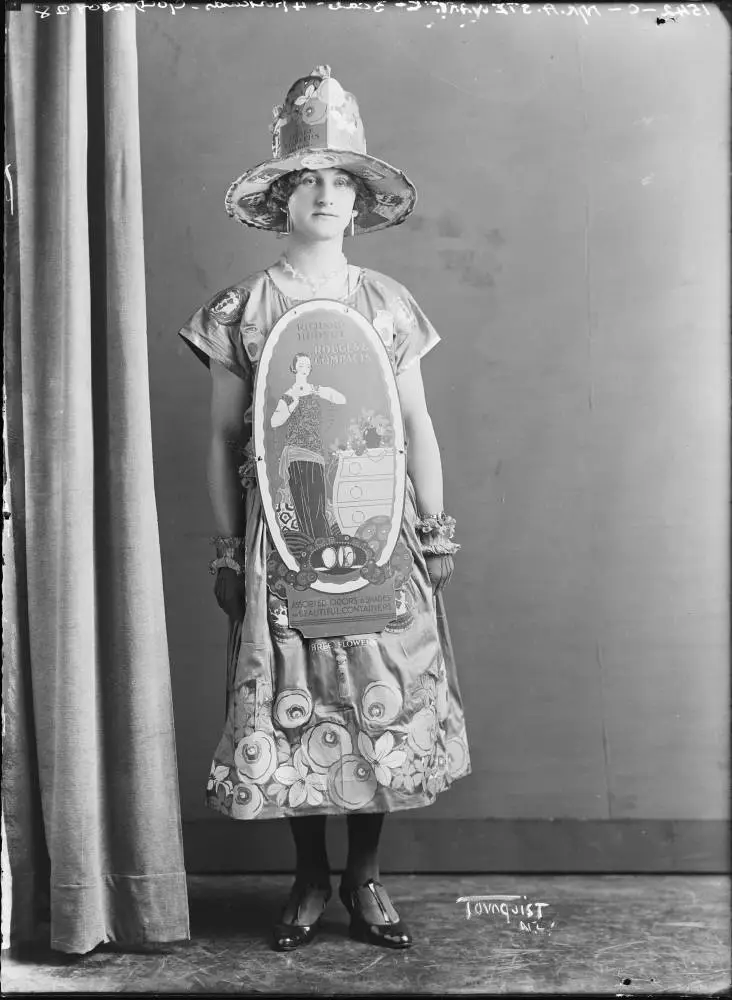 Model wearing dress and hat