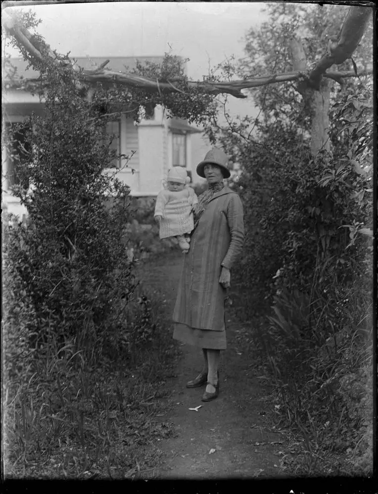 Woman and baby on a garden path