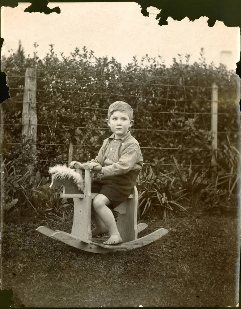John Bartrum on his rocking horse, Takapuna.