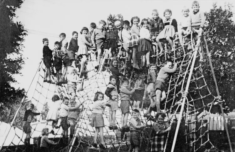 Students of Northcote Primary School on playground climbing frame.