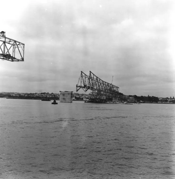 Pick-a-back operation in progress, Auckland Harbour Bridge construction.