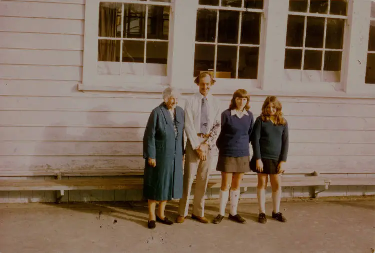 Three generations of the Stevenson family outside Albany School.