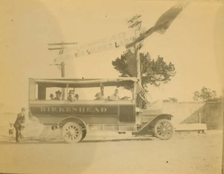 Open-sided Birkenhead bus and passengers.