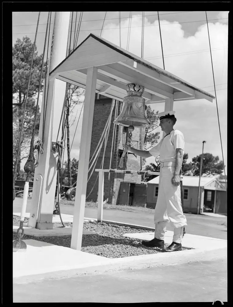 HMS Achilles bell at HMNZS Tamaki, Motuihe Island, 1951
