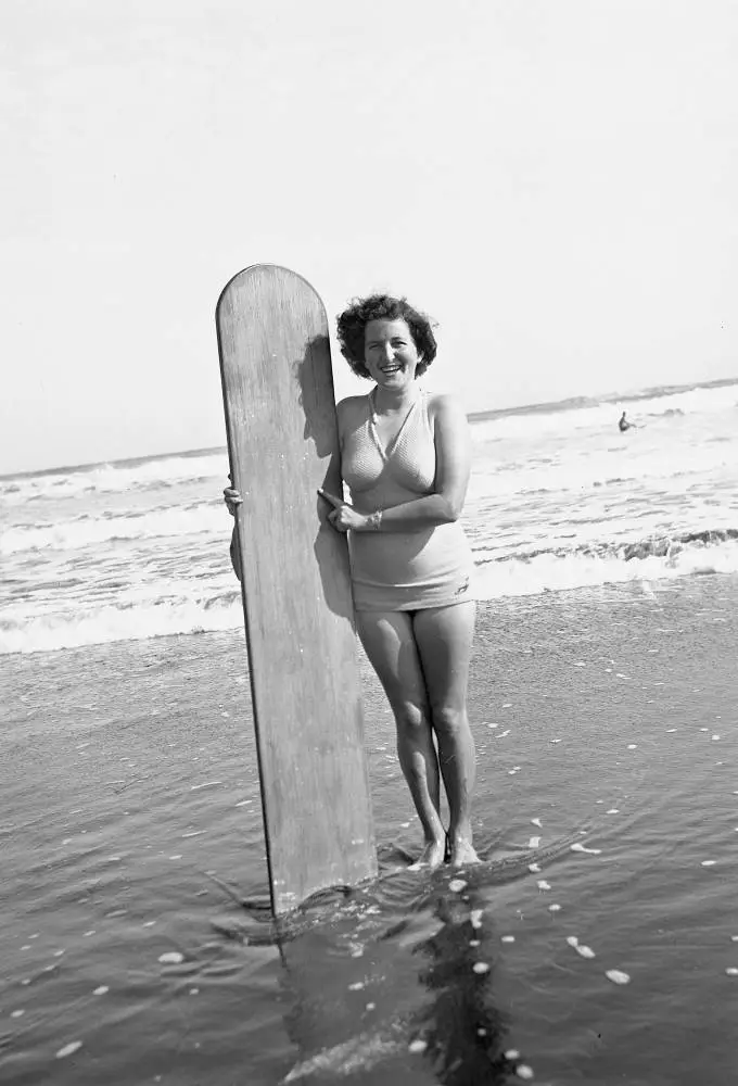Isabel Woods with surf board.