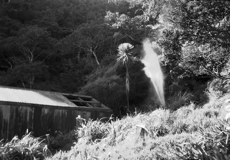 Geyser blowing from joint in flume.
