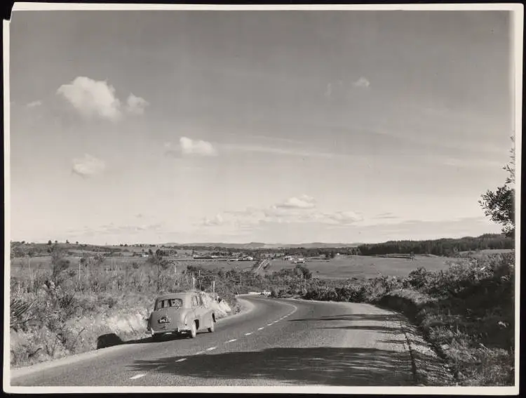 Two cars driving on the Whangarei road, Albany