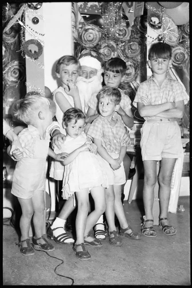 Children sitting on Santa's knee, 1959