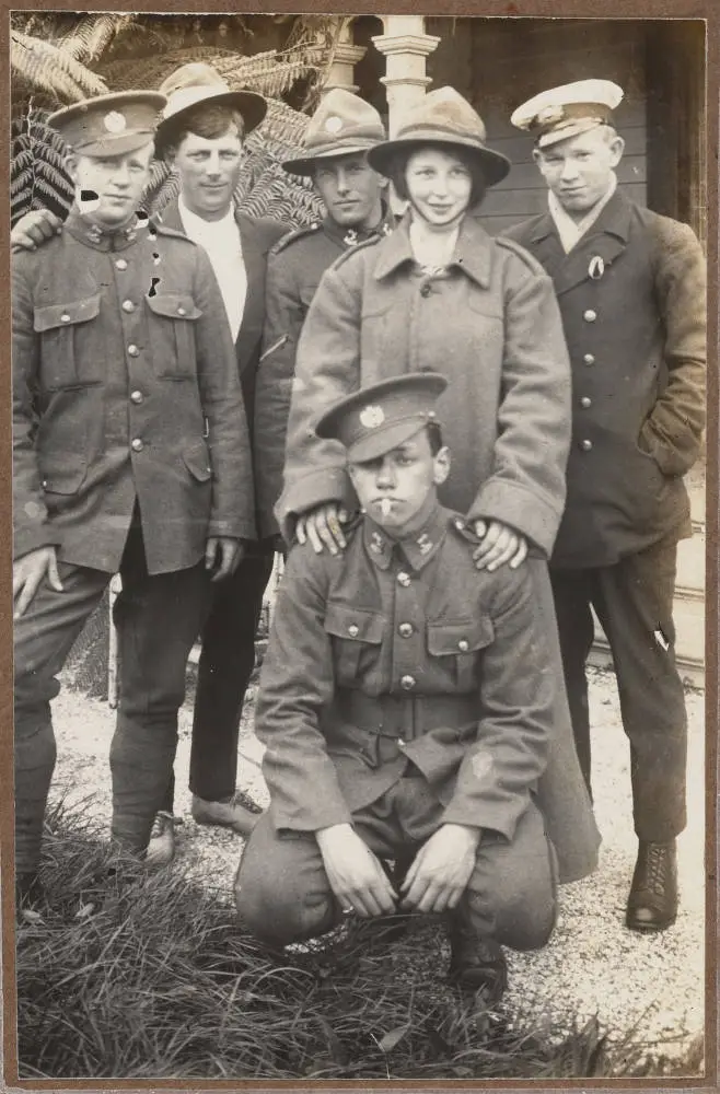 A group of young people, four men in uniform, 1915