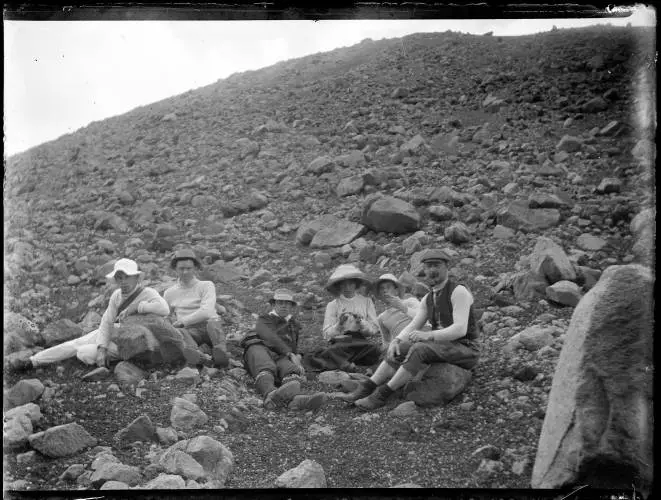 The Spencer family resting on a hike