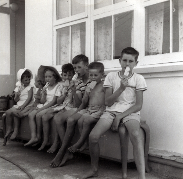 Group of children eating iceblocks