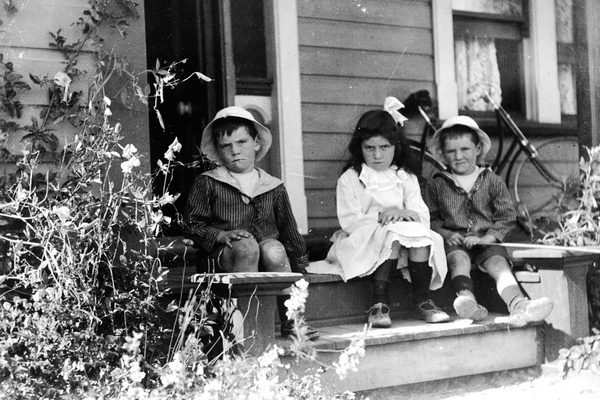 Wilkinson children on verandah of house in Dixon Street