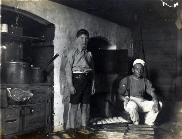 Man and boy in a cookhouse : digital image