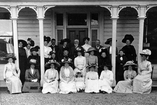 The Deller family outside a house