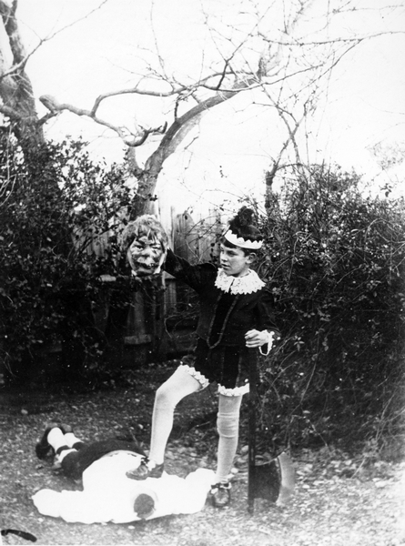 Theatrical scene of a boy having executed a fairy tale monster : photograph