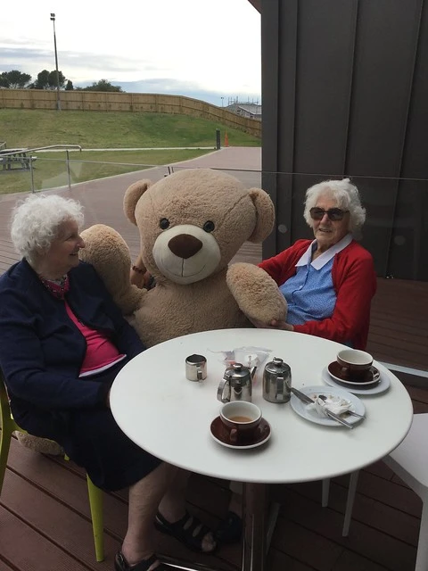 Big Ted with two ladies for coffee