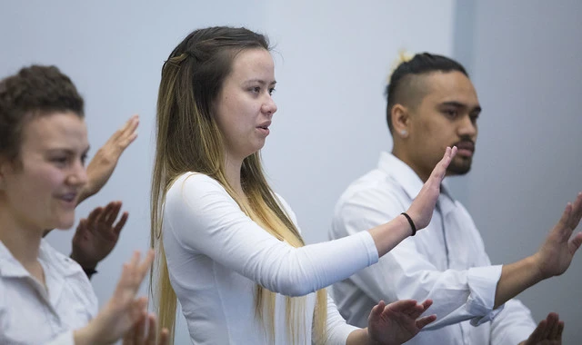 Students from Van Asch Deaf Education Centre perform national anthem