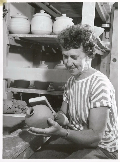 Dame Doreen Blumhardt - a noted New Zealand potter - shaping a pot she has just made.