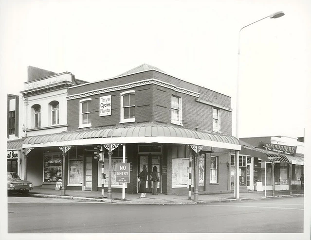 A block of shops on the corner of Cashel Street and Oxford Terrace, Christchurch