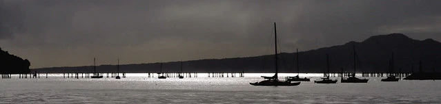 Yachts at anchor under winter skies