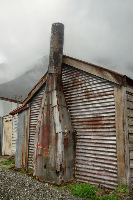 Old house, with metal chimney, Wainihinihi, West Coast, New Zealand