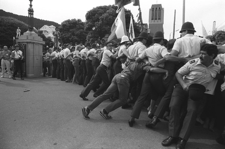Phalanx of straining police near Parliament. Waitangi Day protests, Wellington