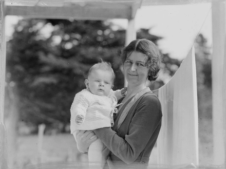 [Portrait of woman holding baby]
