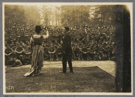 All eyes on the "lady". An open air performance by the Pierrots of a neighbouring division largely attended by N.Z. soldiers.