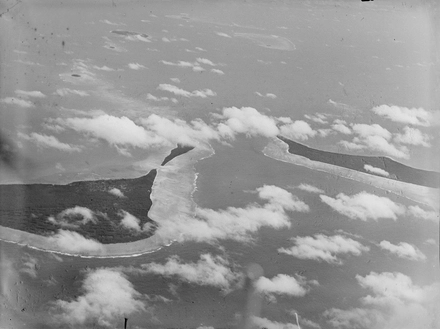 [Aerial view of two atolls]