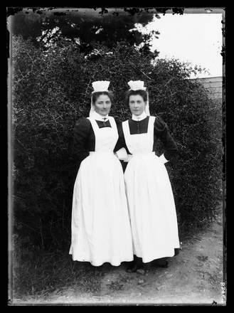 [Portrait of two female attendants in the Avondale Lunatic Asylum grounds]