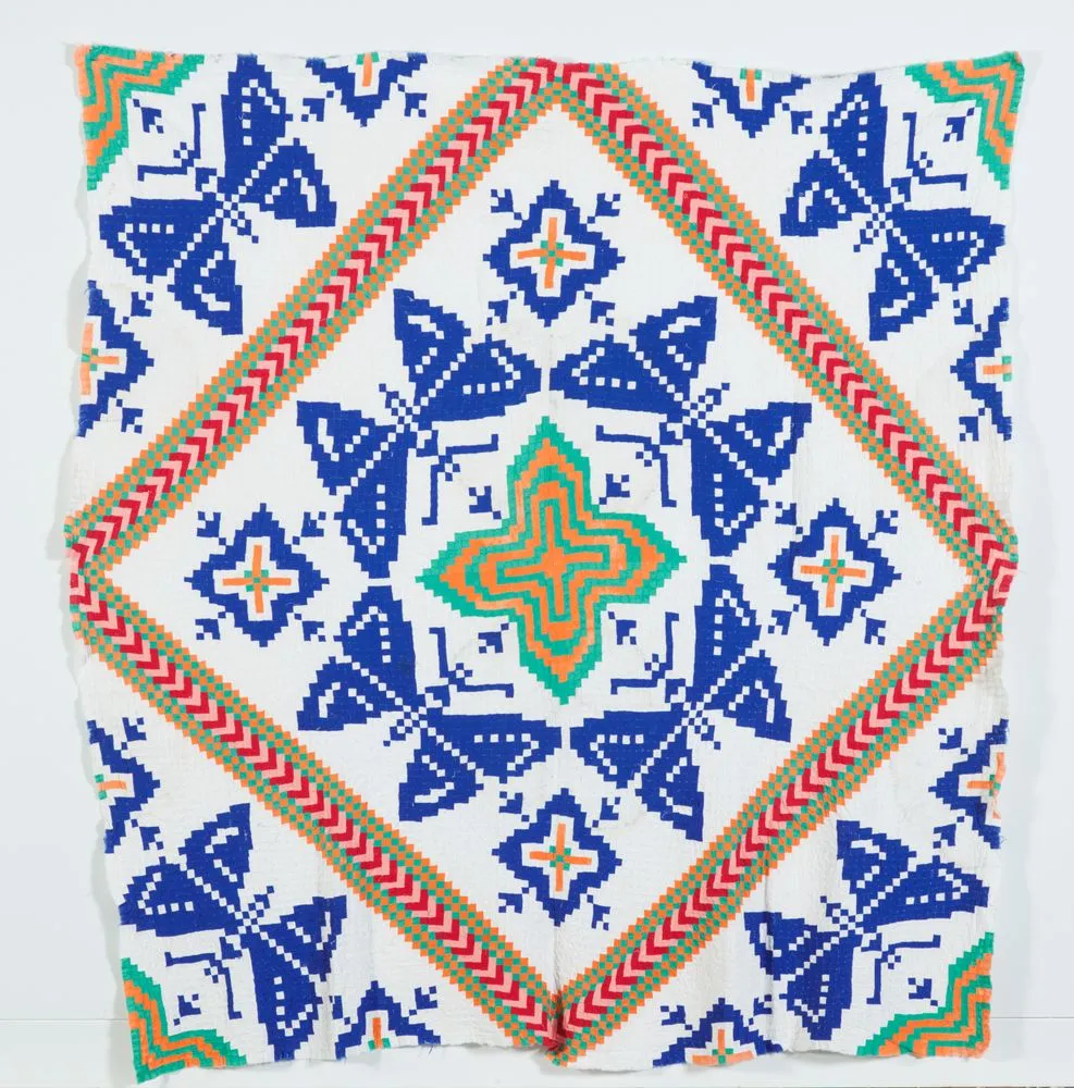Tīvaevae ta’ōrei pepe (patch work quilt with butterfly pattern)