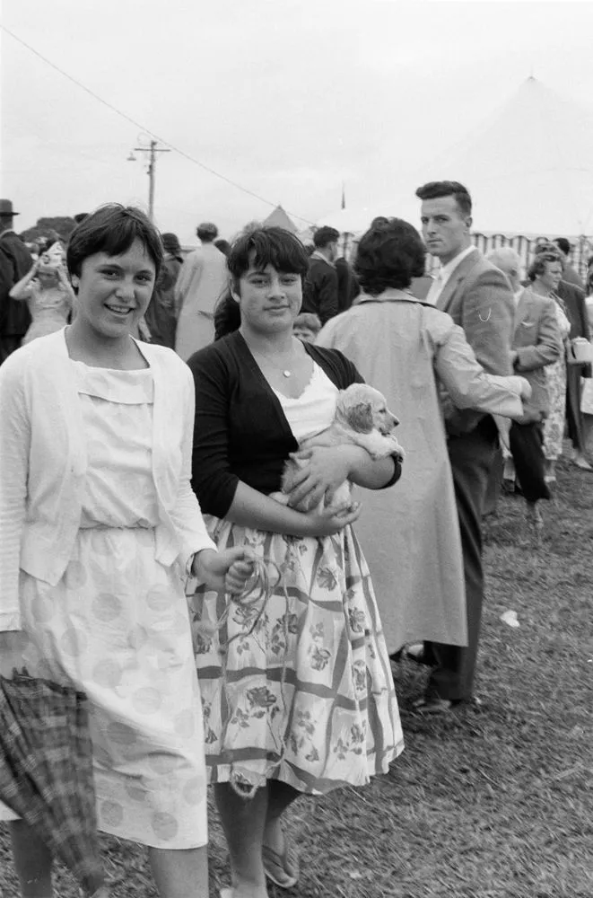 Women with puppy at fair