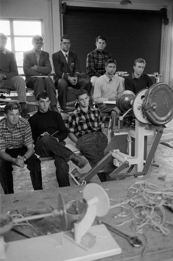 Group of men inside workshop
