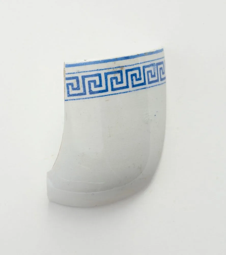 White china fragment with blue 'Greek Key' pattern