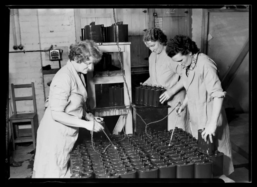 Women electroplating army canteen bottles - World War II